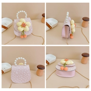 Multi-angle view of pink mini bag with pearl handle, chain strap and yellow flower