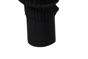 Detailed close-up of black knitted ribbing on men's Henley shirt sleeve cuff
