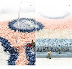Detailed view of thick absorbent flocked bath mat with geometric pattern and edge stitching
