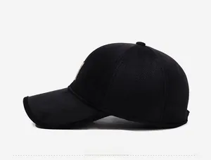 Detail of black waffle texture baseball cap with side view and brown leather patch