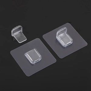 Detail of transparent self-adhesive shelf support peg with strong L-shaped plastic hook