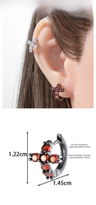 Detailed view of cubic zirconia cross hoop earrings with size dimensions 1.22cm by 1.45cm