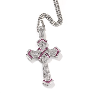 Detail view of silver hip hop cross pendant with red crystals and cubic zirconia