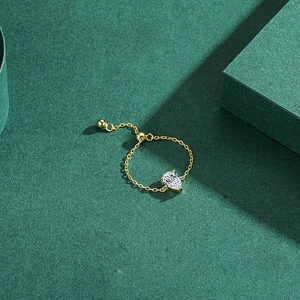 Adjustable S925 silver chain ring with water drop diamond on a green luxury background