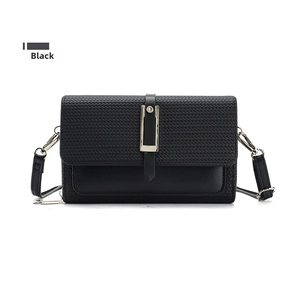 Detail of black crossbody bag with woven texture lid and elegant metal buckle closure