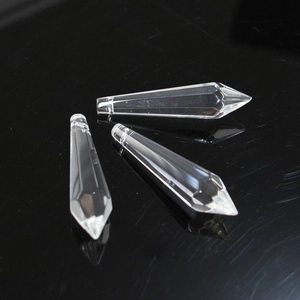 Macro detail of three faceted crystal glass teardrop pendants for DIY lighting decor