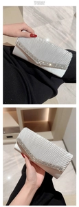 Detail of silver pleated evening clutch bag with V-shaped rhinestone embellishments