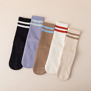 Five pairs of rib-knit yoga five-toe socks in black, purple, brown, white, and beige colors