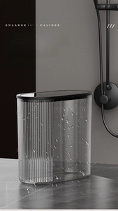 Waterproof transparent toilet paper holder with vertical stripes and black lid detail