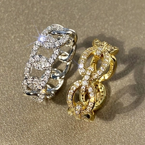 Macro shot of silver and gold plated chain rings with micro-pave cubic zirconia crystals
