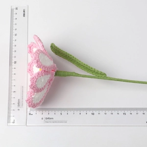 Detailed measurement of handmade crochet tulip flower with pink and white petals
