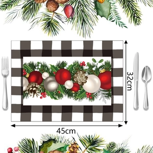 Detail view of 45x32cm Christmas placemat with pine motif and black white plaid border