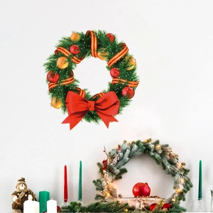 Christmas wreath with red bows and ornaments displayed in a cozy festive home setting