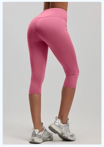 Detailed back view of high-waisted pink yoga capris showing peach lift and stretchy fabric