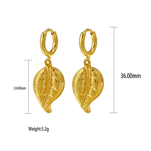 Detail view of gold shell-shaped earrings with 36mm length and weight specifications