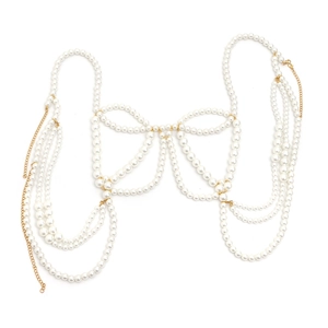Detailed view of layered white pearl and gold chain body jewelry in corset style