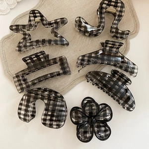 Detailed set of 7 acrylic hair claws with black and white gingham checkered patterns