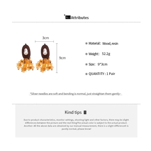 Detailed specs of oval wood and resin earrings with dimensions and materials listed