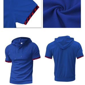 Detail view of royal blue waffle knit hoodie with red and blue plaid trim on sleeves