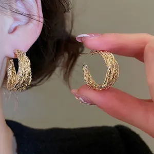 Vintage textured cross pattern golden hoop earrings for women with elegant retro design