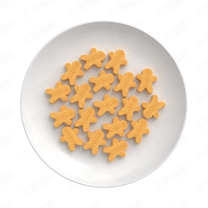 Macro detail of orange gingerbread man shaped silicone baking mold in a white ceramic dish