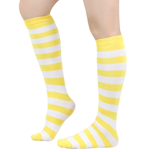 Close-up of yellow and white striped knee-high socks with breathable knit texture