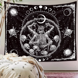 Bohemian black and white wall tapestry made of cotton linen hanging above a bedroom bed