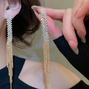 Luxurious silver rhinestone stud earrings with long golden chain tassels for women