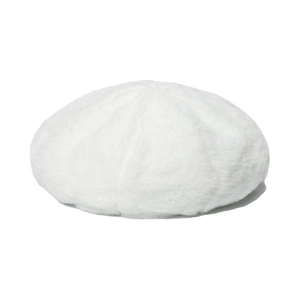 Close-up of the thick faux fur texture and soft fibers of the white winter beret hat