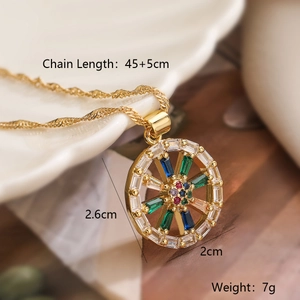 Gold-plated heart geometric pendant necklace with colorful zircons on white ceramic plate