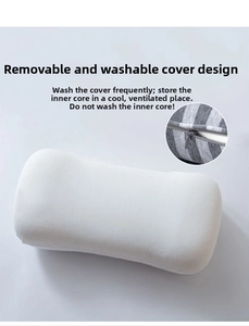 Detail of the memory foam pillow showing the removable grey striped cover and zipper