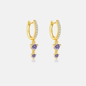 Macro shot of S925 sterling silver hoop earrings with purple zircon and white stones