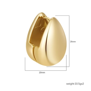 Macro view of gold teardrop huggie earrings with dimensions 26mm by 18mm
