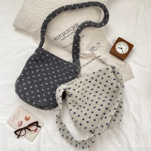 Faux shearling plush tote bags with polka dots shown on a white background with props