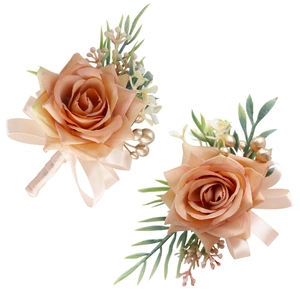 Elegant champagne silk rose wedding boutonniere set with greenery and gold berries