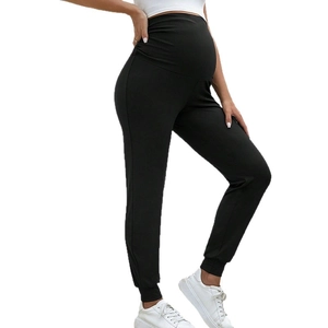 High waist maternity joggers in black elastic knit featuring supportive belly band