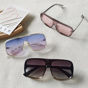 Three pairs of vintage flat top oversized sunglasses in various gradient lens colors