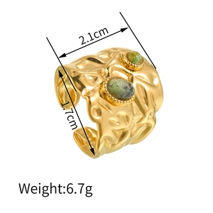 Detail view of gold irregular textured ring with green stone inlays and size metrics