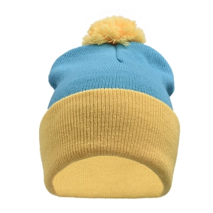 Detail of blue and yellow knit beanie with top pompom and wide folded brim
