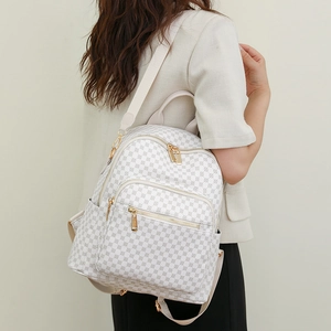 Large capacity waterproof backpack with white and gray geometric pattern on female model
