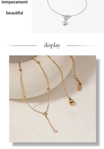 Detail of heart knot and floral zircon pendants on stainless steel necklaces