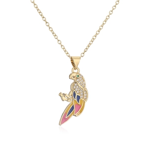 Macro view of lovebird pendant with colorful enamel and zircon inlay on gold chain