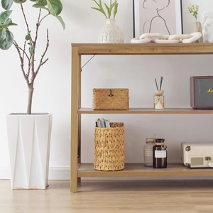 Detail of three-tier light wood storage shelf with black metal side support bars