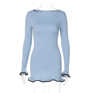 Detail of light blue mini dress featuring black wavy ruffle trim on sleeves and hemline