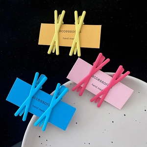 Set of 6 matte candy-colored crisscross hair clips in yellow, pink and blue shades