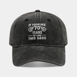 Detailed white embroidery on washed black cotton baseball cap for 70th birthday gift
