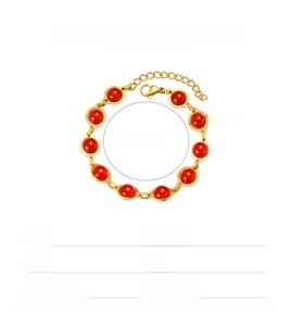 Detail of red bead bracelet with gold stainless steel chain and lobster clasp