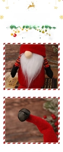 Detail of Christmas gnome with red felt hat, long white beard and festive bell ornament