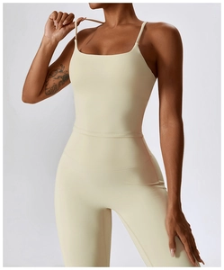 Macro detail of breathable cream yoga jumpsuit with spaghetti straps and square neckline