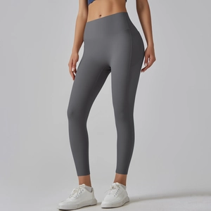 Detail view of high-waisted seamless dark gray yoga pants featuring butt-lifting texture